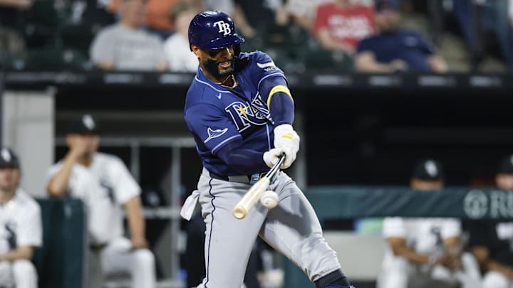 Apr 14, 2026; Chicago, Illinois, USA; Tampa Bay Rays designated hitter Yandy Diaz (2) hits an RBI-single against the Chicago White Sox during the sixth inning at Rate Field. 