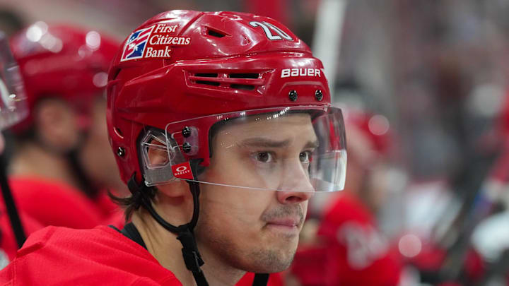 Jan 10, 2026; Raleigh, North Carolina, USA;  Carolina Hurricanes center Sebastian Aho (20) looks on from the players bench against the Seattle Kraken during the first period at Lenovo Center. Mandatory Credit: James Guillory-Imagn Images