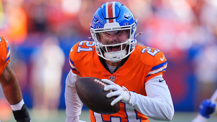 Oct 6, 2024; Denver, Colorado, USA; Denver Broncos cornerback Riley Moss (21) celebrates his interception in the second half against the Las Vegas Raiders at Empower Field at Mile High. 