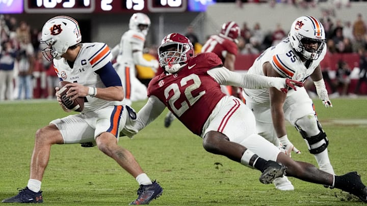 Alabama Crimson Tide defensive lineman LT Overton (22) pressures Auburn Tigers quarterback Payton Thorne (1) Alabama Crimson Tide defensive lineman LT Overton (22) pressures Auburn Tigers quarterback Payton Thorne (1)