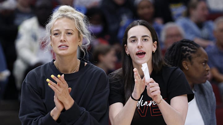 Jun 7, 2025; Chicago, Illinois, USA; Injured Indiana Fever guard Sophie Cunningham (8) and guard Caitlin Clark (22) react from the bench during the first half of a WNBA game against the Chicago Sky at United Center. Mandatory Credit: Kamil Krzaczynski-Imagn Images