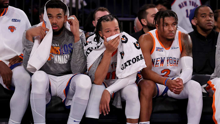 Jan 10, 2025; New York, New York, USA; New York Knicks center Karl-Anthony Towns (32) and guards Jalen Brunson (11) and Miles McBride (2) watch from the bench during the fourth quarter against the Oklahoma City Thunder at Madison Square Garden. Mandatory Credit: Brad Penner-Imagn Images