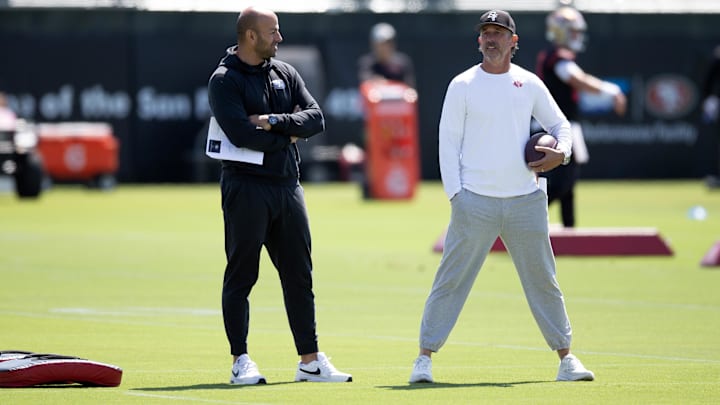 Jun 10, 2025; Santa Clara, CA, USA; San Francisco 49ers head coach Kyle Shanahan (right) and defensive coordinator Robert Saleh confer during an OTA at Levi's Stadium. Mandatory Credit: D. Ross Cameron-Imagn Images