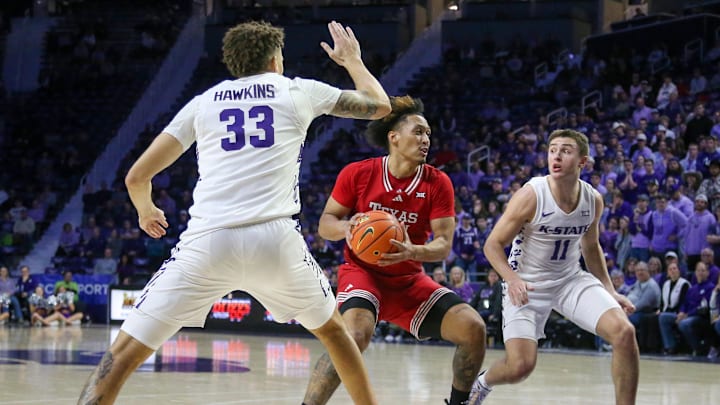 Jan 14, 2025; Manhattan, Kansas, USA; Texas Tech Red Raiders forward Darrion Williams (5) drives to the basket against Kansas State Wildcats guard Brendan Hausen (11) and forward Coleman Hawkins (33) during the second half at Bramlage Coliseum. Mandatory Credit: Scott Sewell-Imagn Images