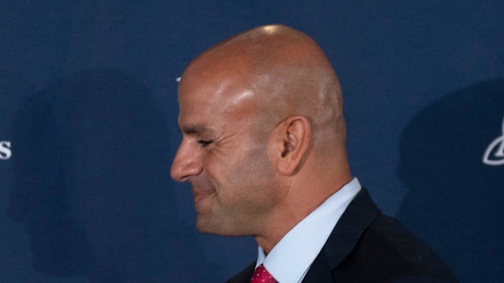 Tennessee Titans general manager Mike Borgonzi and Robert Saleh shake hands at the introductory press conference.