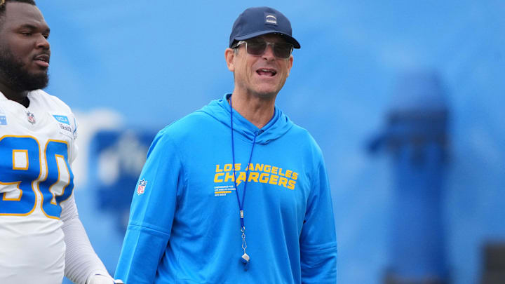 Jul 21, 2025; El Segundo, CA, USA; Los Angeles Chargers defensive lineman Teair Tart (90) and coach Jim Harbaugh at training camp at The Bolt. Mandatory Credit: Kirby Lee-Imagn Images