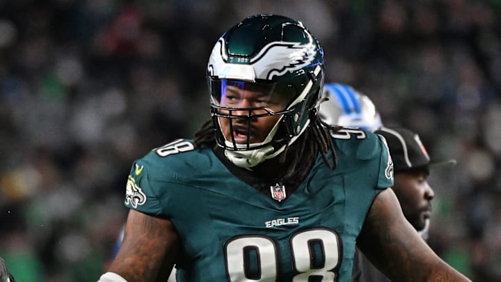 Nov 16, 2025; Philadelphia, Pennsylvania, USA;  Philadelphia Eagles defensive tackle Jalen Carter (98) celebrates a stop with linebacker Jaelan Phillips (50) against the Detroit Lions at Lincoln Financial Field. Mandatory Credit: Eric Hartline-Imagn Images