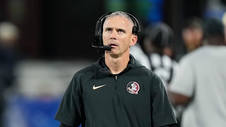 Dec 2, 2023; Charlotte, NC, USA;  Florida State Seminoles head coach Mike Norvell walks the sidelines during the third quarter against the Louisville Cardinals at Bank of America Stadium. Mandatory Credit: Jim Dedmon-Imagn Images