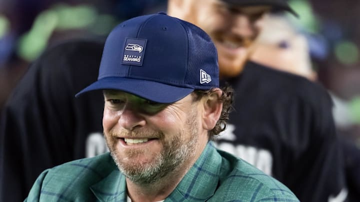 Seattle Seahawks general manager John Schneider celebrates with the Vince Lombardi trophy.