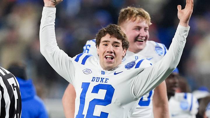 Dec 6, 2025; Charlotte, NC, USA; Duke Blue Devils quarterback Dan Mahan (12) celebrates defeating the Virginia Cavaliers during the 2025 ACC Championship game at Bank of America Stadium. Mandatory Credit: Jim Dedmon-Imagn Images Dec 6, 2025; Charlotte, NC, USA; Duke Blue Devils quarterback Dan Mahan (12) celebrates defeating the Virginia Cavaliers during the 2025 ACC Championship game at Bank of America Stadium. Mandatory Credit: Jim Dedmon-Imagn Images