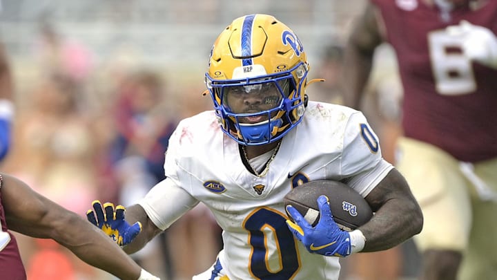 Oct 11, 2025; Tallahassee, Florida, USA; Pittsburgh Panthers running back Desmond Reid (0) runs the ball past Florida State Seminoles defensive back Jerry Wilson (19) during the second half at Doak S. Campbell Stadium. Mandatory Credit: Melina Myers-Imagn Images Oct 11, 2025; Tallahassee, Florida, USA; Pittsburgh Panthers running back Desmond Reid (0) runs the ball past Florida State Seminoles defensive back Jerry Wilson (19) during the second half at Doak S. Campbell Stadium. Mandatory Credit: Melina Myers-Imagn Images