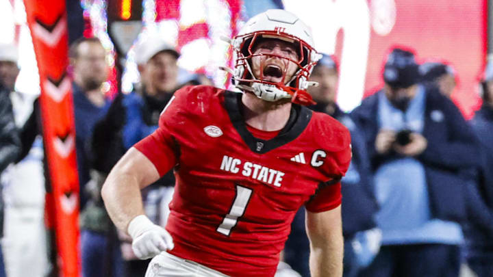 Nov 29, 2025; Raleigh, North Carolina, USA; NC State Wolfpack linebacker Caden Fordham (1) reacts to his tackle during the first half of the game against North Carolina Tar Heels at Carter-Finley Stadium.  Mandatory Credit: Jaylynn Nash-Imagn Images