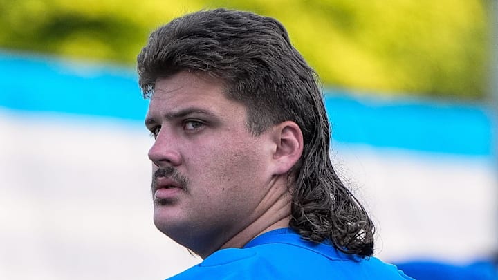 Detroit Lions guard Tate Ratledge (69) walks onto the field for practice during training camp Detroit Lions guard Tate Ratledge (69) walks onto the field for practice during training camp