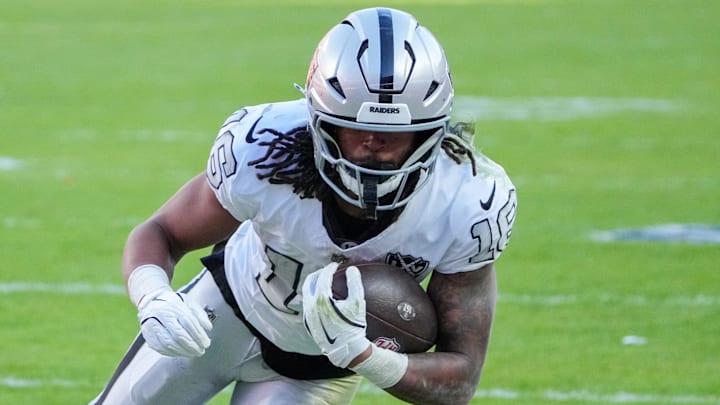 Nov 29, 2024; Kansas City, Missouri, USA; Las Vegas Raiders wide receiver Jakobi Meyers (16) runs the ball against the Kansas City Chiefs during the first half at GEHA Field at Arrowhead Stadium. Mandatory Credit: Denny Medley-Imagn Images