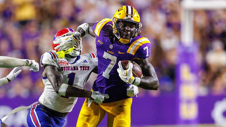 LSU Tigers tight end Trey'Dez Green (7) runs against Louisiana Tech Bulldogs defensive back Sam Fongang (1) during the second half at Tiger Stadium. LSU Tigers tight end Trey'Dez Green (7) runs against Louisiana Tech Bulldogs defensive back Sam Fongang (1) during the second half at Tiger Stadium.