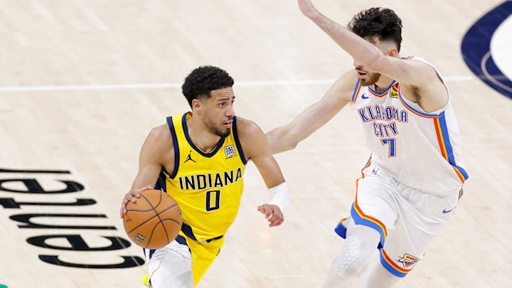 Jun 16, 2025; Oklahoma City, Oklahoma, USA; Indiana Pacers guard Tyrese Haliburton (0) drives to the basket past Oklahoma City Thunder forward Chet Holmgren (7) during the fourth quarter in game five of the 2025 NBA Finals at Paycom Center. Mandatory Credit: Alonzo Adams-Imagn Images