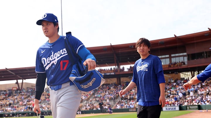 Dodgers designated hitter Shohei Ohtani (17) with translator Ippei Mizuhara against the Chicago White Sox during a spring training baseball game at Camelback Ranch-Glendale.