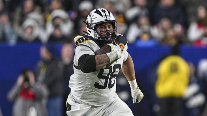 Dec 14, 2024; Landover, Maryland, USA;  Navy Midshipmen defensive tackle Landon Robinson (96) runs on na fake punt during the second half  against the Army Black Knights at Commanders Field. Mandatory Credit: Tommy Gilligan-Imagn Images