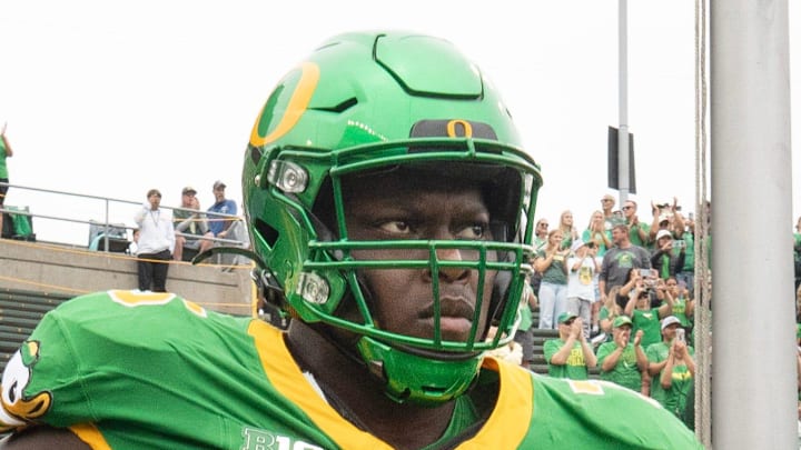 Oregon’s Emmanuel Pregnon, center, takes the field before the game against Oklahoma State at Autzen. Oregon’s Emmanuel Pregnon, center, takes the field before the game against Oklahoma State at Autzen.