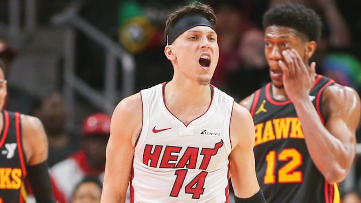 Apr 9, 2024; Atlanta, Georgia, USA; Miami Heat guard Tyler Herro (14) reacts after a basket against the Atlanta Hawks in the second half at State Farm Arena. Mandatory Credit: Brett Davis-Imagn Images