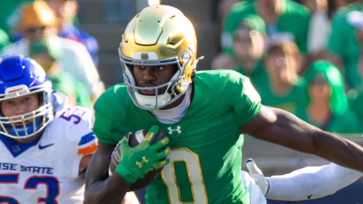 Oct 4, 2025; South Bend, Indiana, USA; Notre Dame Fighting Irish wide receiver Malachi Fields (0) fights for extra yards against the Boise State Broncos during the first half at Notre Dame Stadium. 