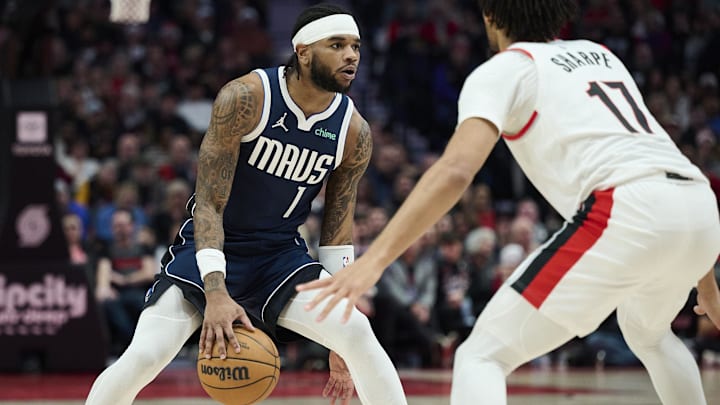 Dec 28, 2024; Portland, Oregon, USA; Dallas Mavericks guard Jaden Hardy (1) dribbles the basketball during the first half against Portland Trail Blazers guard Shaedon Sharpe (17) at Moda Center. Mandatory Credit: Troy Wayrynen-Imagn Images
