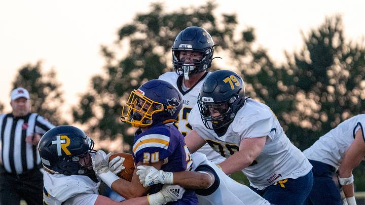 A host of Regals tackle Alburnett’s Laken Caves (24) during a high school football game Sept. 10, 2026 in Alburnett, Iowa. A host of Regals tackle Alburnett’s Laken Caves (24) during a high school football game Sept. 10, 2026 in Alburnett, Iowa.