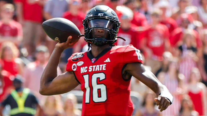 Oct 5, 2024; Raleigh, North Carolina, USA;  North Carolina State Wolfpack quarterback CJ Bailey (16) throws the ball during the first half of the game against Wake Forest Demon Deacons at Carter-Finley Stadium. Mandatory Credit: Jaylynn Nash-Imagn Images