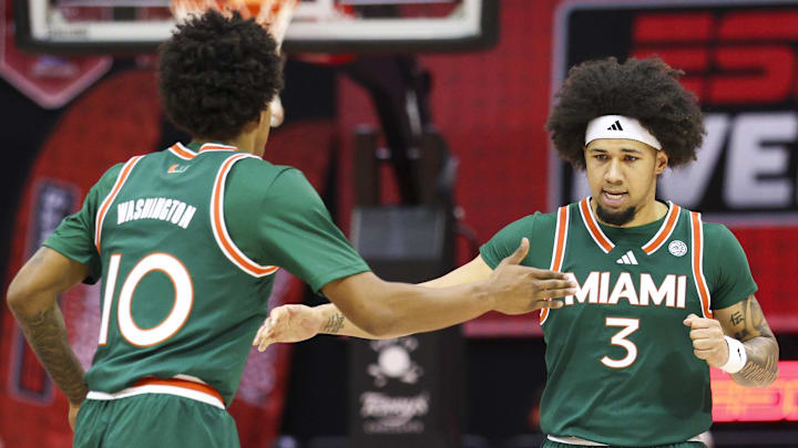 Nov 28, 2025; Kissimmee, FL, USA; Miami (FL) Hurricanes guard Tru Washington (10) and guard Tre Donaldson (3) react after a basket against the Georgetown Hoyas in the first half during the ESPN Events Invitational at State Farm Field House. Mandatory Credit: Nathan Ray Seebeck-Imagn Images