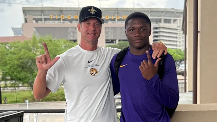 A five-star wide receiver recruit shared a photo with LSU head coach Lane Kiffin on social media. A five-star wide receiver recruit shared a photo with LSU head coach Lane Kiffin on social media.