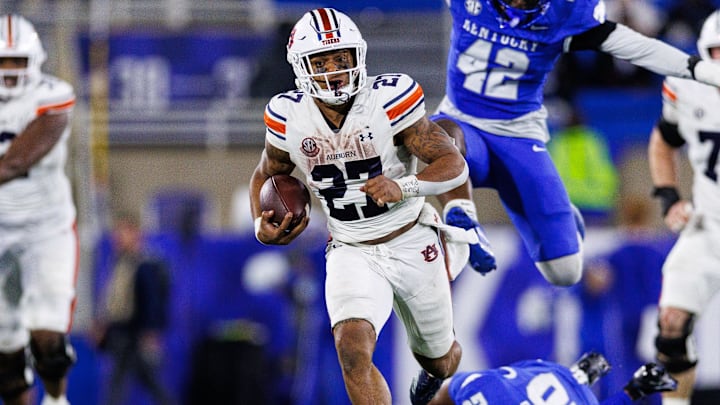 Oct 26, 2024; Lexington, Kentucky, USA; Auburn Tigers running back Jarquez Hunter (27) runs the ball during the fourth quarter against the Kentucky Wildcats at Kroger Field. Oct 26, 2024; Lexington, Kentucky, USA; Auburn Tigers running back Jarquez Hunter (27) runs the ball during the fourth quarter against the Kentucky Wildcats at Kroger Field.