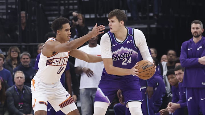 Oct 27, 2025; Salt Lake City, Utah, USA; Utah Jazz center Walker Kessler (24) looks to pass against Phoenix Suns forward Oso Ighodaro (11) during the first quarter at Delta Center. Mandatory Credit: Rob Gray-Imagn Images Oct 27, 2025; Salt Lake City, Utah, USA; Utah Jazz center Walker Kessler (24) looks to pass against Phoenix Suns forward Oso Ighodaro (11) during the first quarter at Delta Center. Mandatory Credit: Rob Gray-Imagn Images
