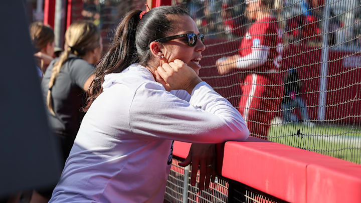 Arkansas coach Courtney Deifel looks on from the dugout against St. Louis in the first game of the Fayetteville Regional