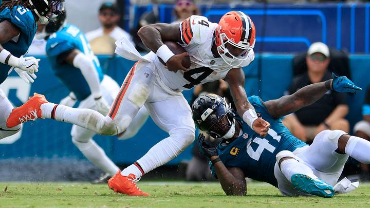 Cleveland Browns quarterback Deshaun Watson (4) is knocked off balance by Jacksonville Jaguars defensive end Josh Hines-Allen (41) as safety Antonio Johnson (6) finishes the tackle off during the fourth quarter of an NFL football matchup at EverBank Stadium on Sunday, Sept. 13, 2026, in Jacksonville, Fla. The Jaguars defeated the Browns 34-10. [Corey Perrine/Florida Times-Union]