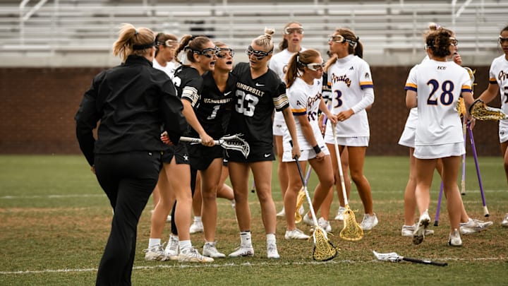 Vanderbilt lacrosse players celebrate.