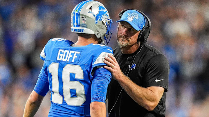 Detroit Lions quarterback Jared Goff (16) talks to head coach Dan Campbell at a timeout against the Los Angeles Rams during the first half at Ford Field in Detroit on Sunday, September 8, 2024.
