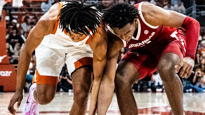 Texas Longhorns guard Tre Johnson (20) battles Arkansas Razorbacks forward Karter Knox (11) for a loose ball in the first half as the Longhorns take on the Razorbacks at the Moody Center, Feb. 5, 2025. Arkansas won the game 78-70.