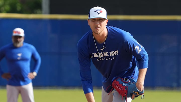 Feb 16, 2025; Dunedin, FL, USA; Toronto Blue Jays pitcher Jeff Hoffman (23) looks to the plate during a pick-off drill during spring training practice at TD Ballpark.