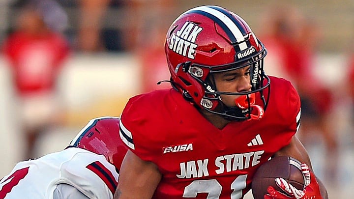 Jacksonville State's Andre Devine tries to evade the tackle of Jacksonville State's Morven Joseph during spring football action in Jacksonville, Alabama April 17, 2025. (Dave Hyatt / Hyatt Media LLC)