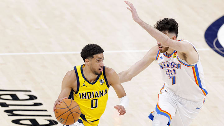 Jun 16, 2025; Oklahoma City, Oklahoma, USA; Indiana Pacers guard Tyrese Haliburton (0) drives to the basket past Oklahoma City Thunder forward Chet Holmgren (7) during the fourth quarter in game five of the 2025 NBA Finals at Paycom Center. Mandatory Credit: Alonzo Adams-Imagn Images