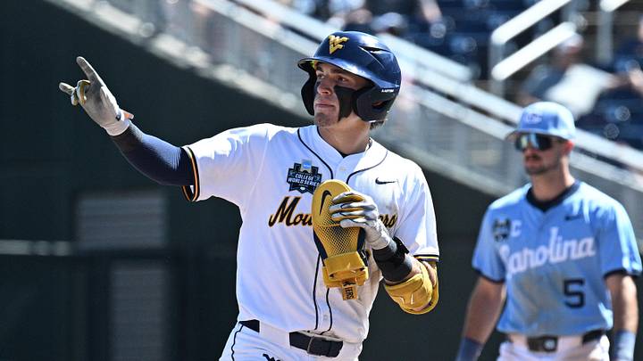 Jun 17, 2026; Omaha, NE, USA;  West Virginia Mountaineers second baseman Gavin Kelly (2) signals after hitting a home run against the West Virginia Mountaineers during the eighth inning at Charles Schwab Field. Mandatory Credit: Steven Branscombe-Imagn Images