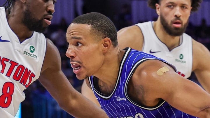Orlando Magic guard Desmond Bane drives around Detroit Pistons guard Caris LeVert.