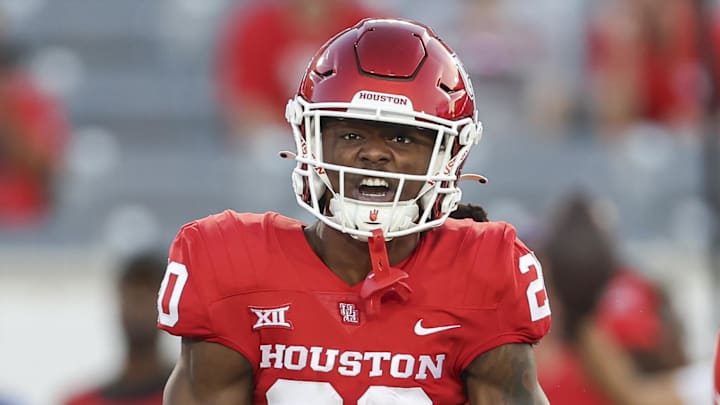 Oct 26, 2024; Houston, Texas, USA; Houston Cougars defensive back Jeremiah Wilson (20) reacts after making a tackle during the first quarter against the Utah Utes at TDECU Stadium. Mandatory Credit: Troy Taormina-Imagn Images