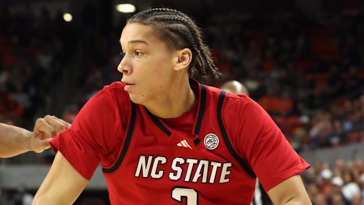 Dec 3, 2025; Auburn, Alabama, USA;  NC State Wolfpack guard Matt Able (3) drives against Auburn Tigers guard Keyshawn Hall (7) during the first half at Neville Arena. Mandatory Credit: John Reed-Imagn Images