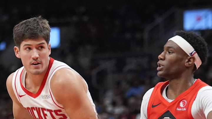 Houston Rockets guard Reed Sheppard drives to the net against Toronto Raptors guard Ja'Kobe Walter.