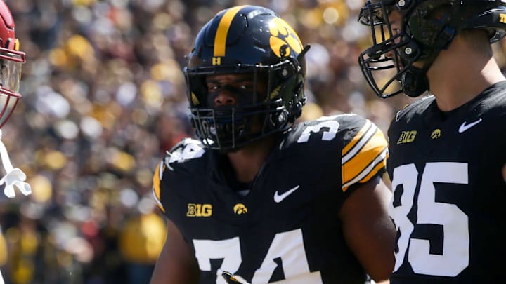 Iowa State’s Darien Porter (10) shakes hands with Iow’s Jay Higgins (34) and Luke Lachey (85) after the coin toss at the CyHawk game Saturday, Sept. 7, 2024 at Kinnick Stadium in Iowa City, Iowa.