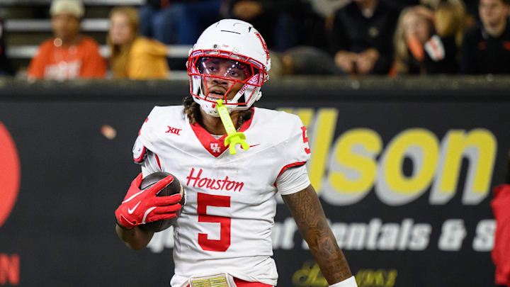 USA; Houston Cougars wide receiver Stephon Johnson (5) scores a touchdown on a pass during the fourth quarter.