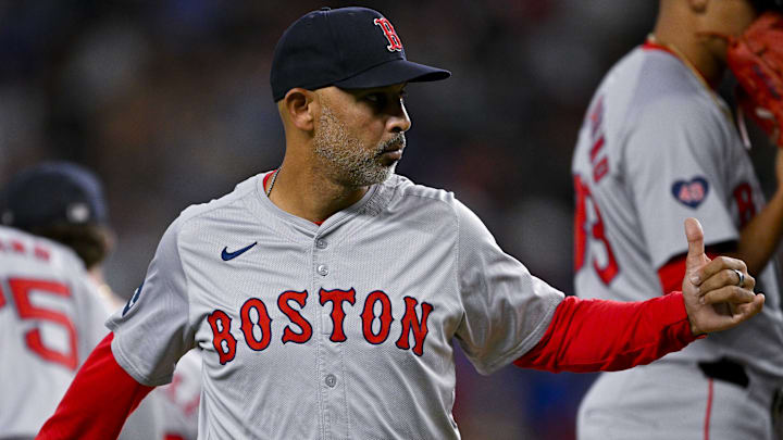 Boston Red Sox manager Alex Cora (13) gives a thumbs up to the umpire during the sixth inning against the Texas Rangers at Globe Life Field.