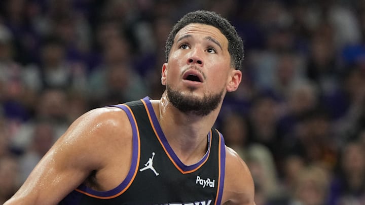 Apr 25, 2026; Phoenix, Arizona, USA; Phoenix Suns guard Devin Booker (1) blocks out against the Oklahoma City Thunder in the first half during game three of the first round of the 2026 NBA Playoffs at Mortgage Matchup Center. Mandatory Credit: Rick Scuteri-Imagn Images