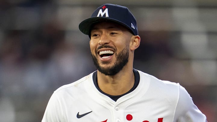 Apr 15, 2025; Minneapolis, Minnesota, USA; Minnesota Twins shortstop Carlos Correa (4) smiles after making a diving catch against the New York Mets in the fifth inning at Target Field. All players wore #42 for Jackie Robinson Day